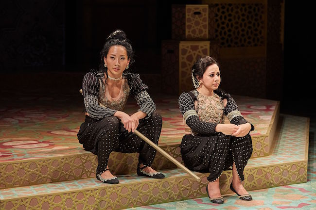 Roshni and Hamida, two female guards, relax in a scene from the premier of 'House of Joy' at the Repertory Theatre of St. Louis, photo by Eric Woosley.