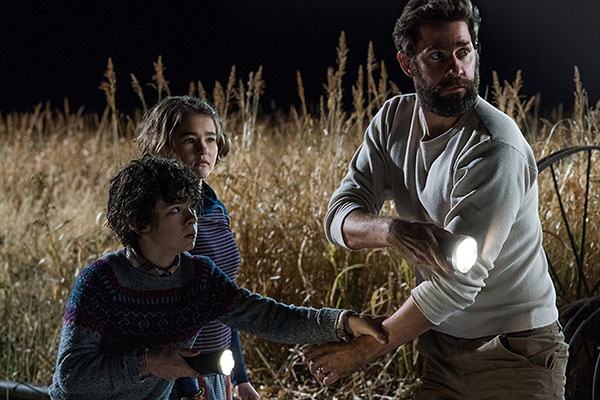 John Krasinski, Noah Jupe, and Millicent Simmonds in A Quiet Place (2018). Photo Credit: Jonny Cournoyer - © 2018 Paramount Pictures. All rights reserved.