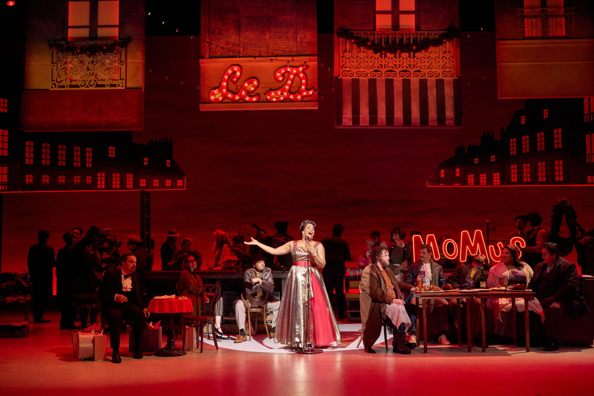 The Café Momus scene. Photo by Eric Woolsey courtesy of Opera Theatre The Café Momus scene. Photo by Eric Woolsey courtesy of Opera Theatre