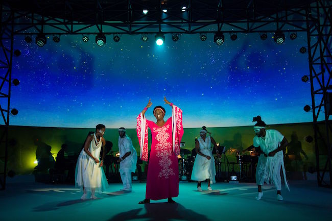 Somi Kakoma, as Miriam Makeba, is joined by the ensemble and musicians in The Rep St Louis world premier of 'Dreaming Zenzile,' photo by T Charles Erickson.