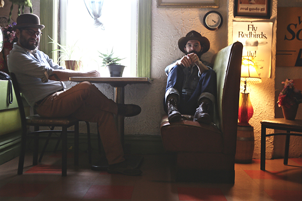 Ethan Leinwand and Nick Pence sit at a booth.